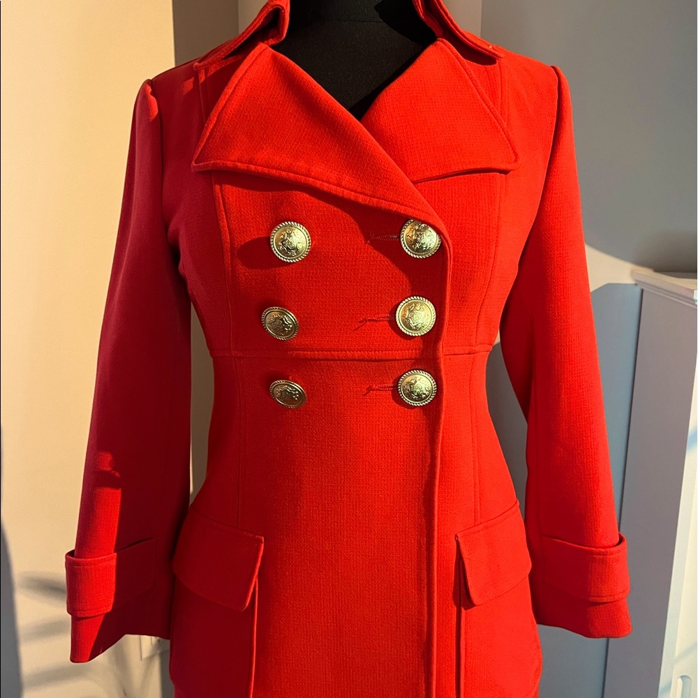 Vibrant and stylish orange trench coat